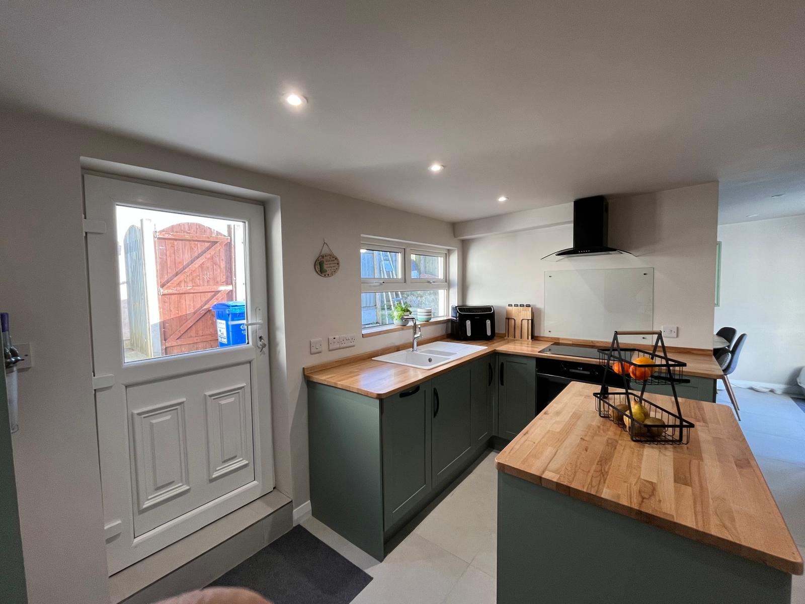 Renovated kitchen with new back door, worktops and fitted units