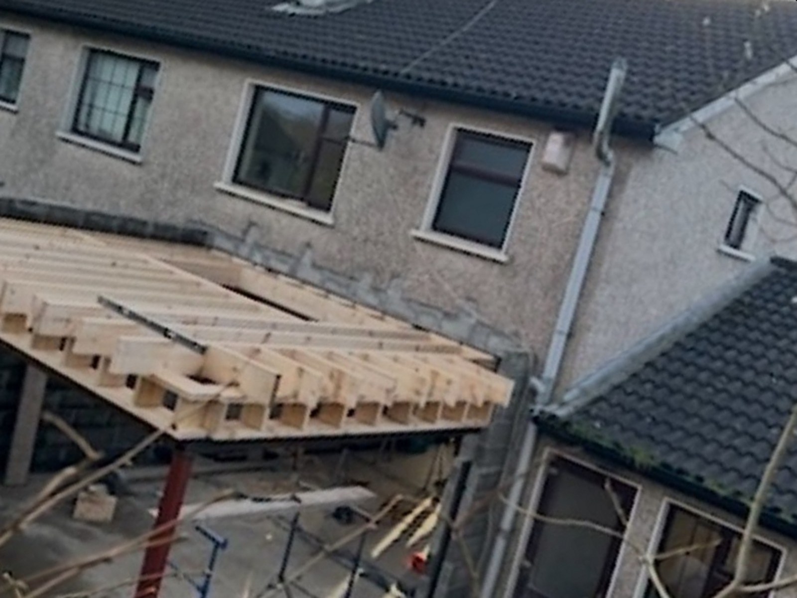 Rear extension under construction by A&C with new timber roof joists and a steel beam in place